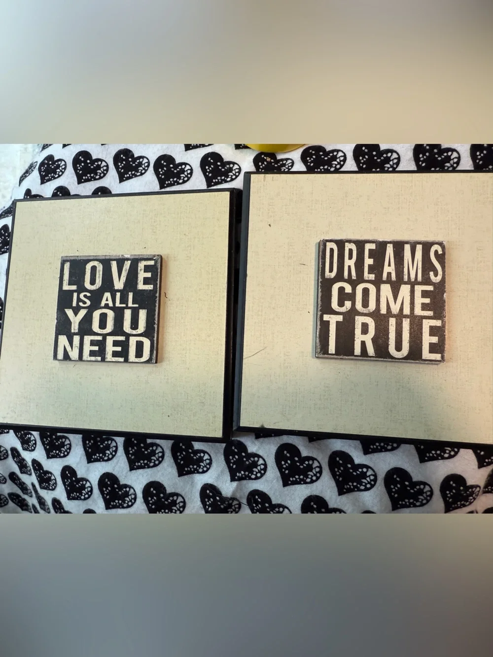 inspirational wall plaques feature distressed black typography on a white